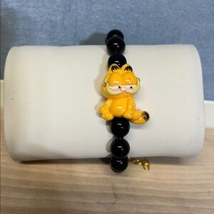 Black glass Beaded Bracelet with Yellow Tiger Charm style Garfield